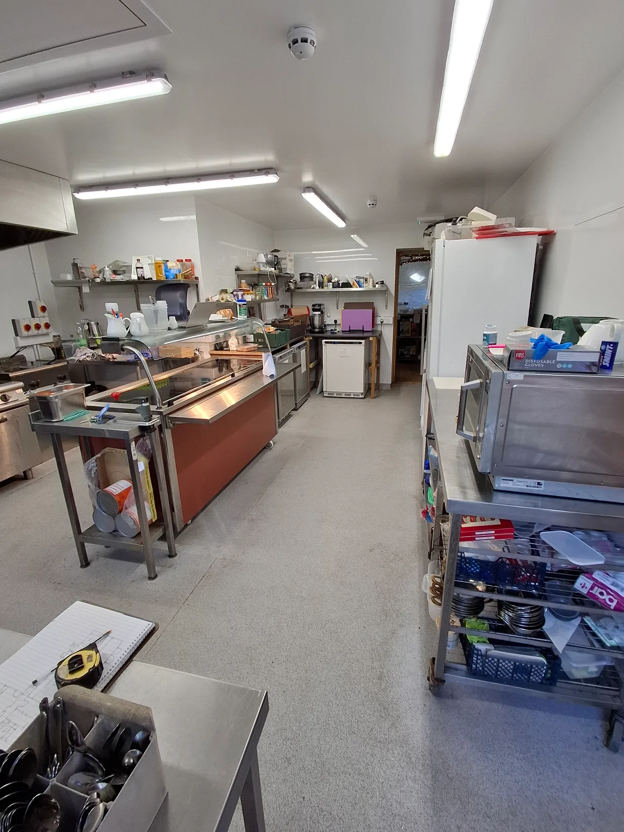 The Hub’s new kitchen with stainless steel work surfaces, cooking equipment and food preparation space
