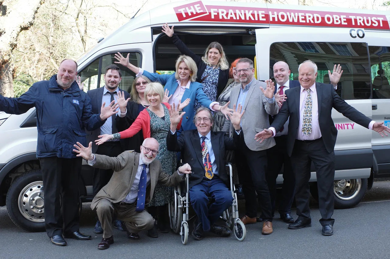 Trust representatives and local supporters gathered beside the community minibus